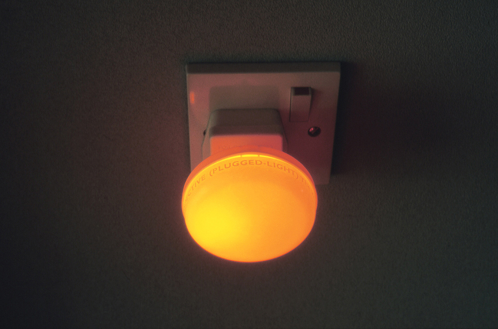 Art, artwork. An installation entitled "Retrospective (Plugged-Light)" by Nika Span / Nika Špan. Material: Plug-in night-lights with a diameter of 7 cm, adhesive foil. Exhibitions: „...Durchschnittlich in Tagen...“, Kreishaus, Gütersloh, Germany Zero Gravity, Salon 3, London; Cornerhouse, Manchester, United Kingdom