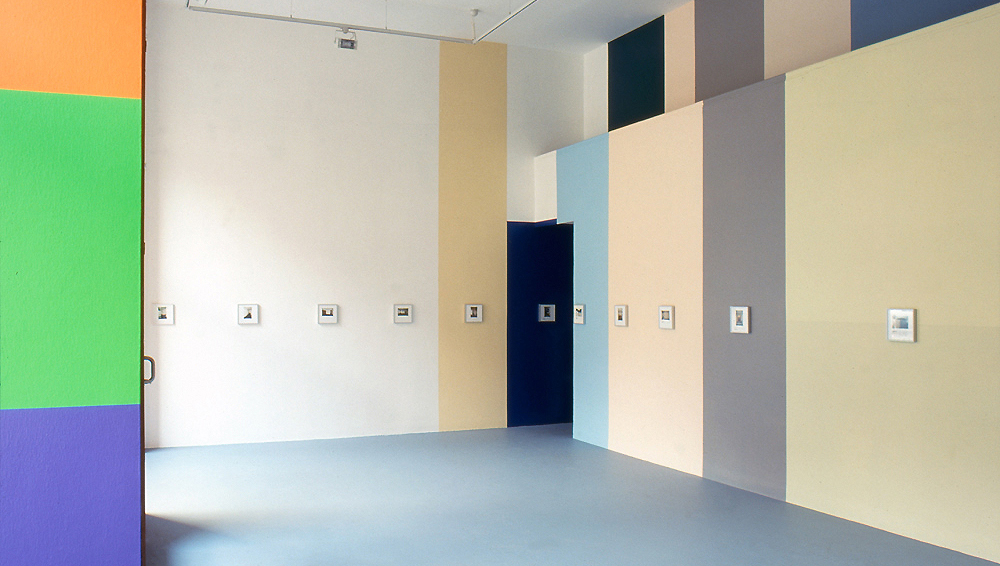 Art, artwork. An installation entitled "Sold Works" by Nika Span / Nika Špan. Material: Wall paint, lacquer, 19 framed photos with colour marks, the performance, loudspeakers, a VHS cassette, a VHS-player, a monitor, 2 slide projections. Exhibition space: Moderna galerija, Mala galerija, Ljubljana, Slovenia